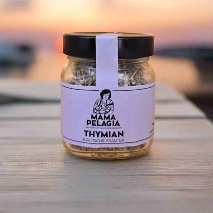 Jar of thyme with 'Mama Pelagia' label on a beige background